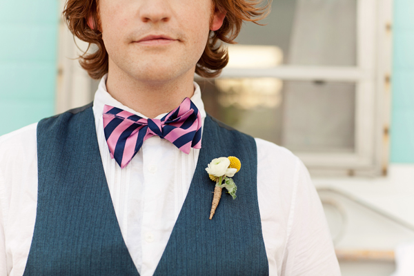 Modern pink and navy bow tie paired with yellow and white vintage inspired boutonniere - Photos by Studio 6.23